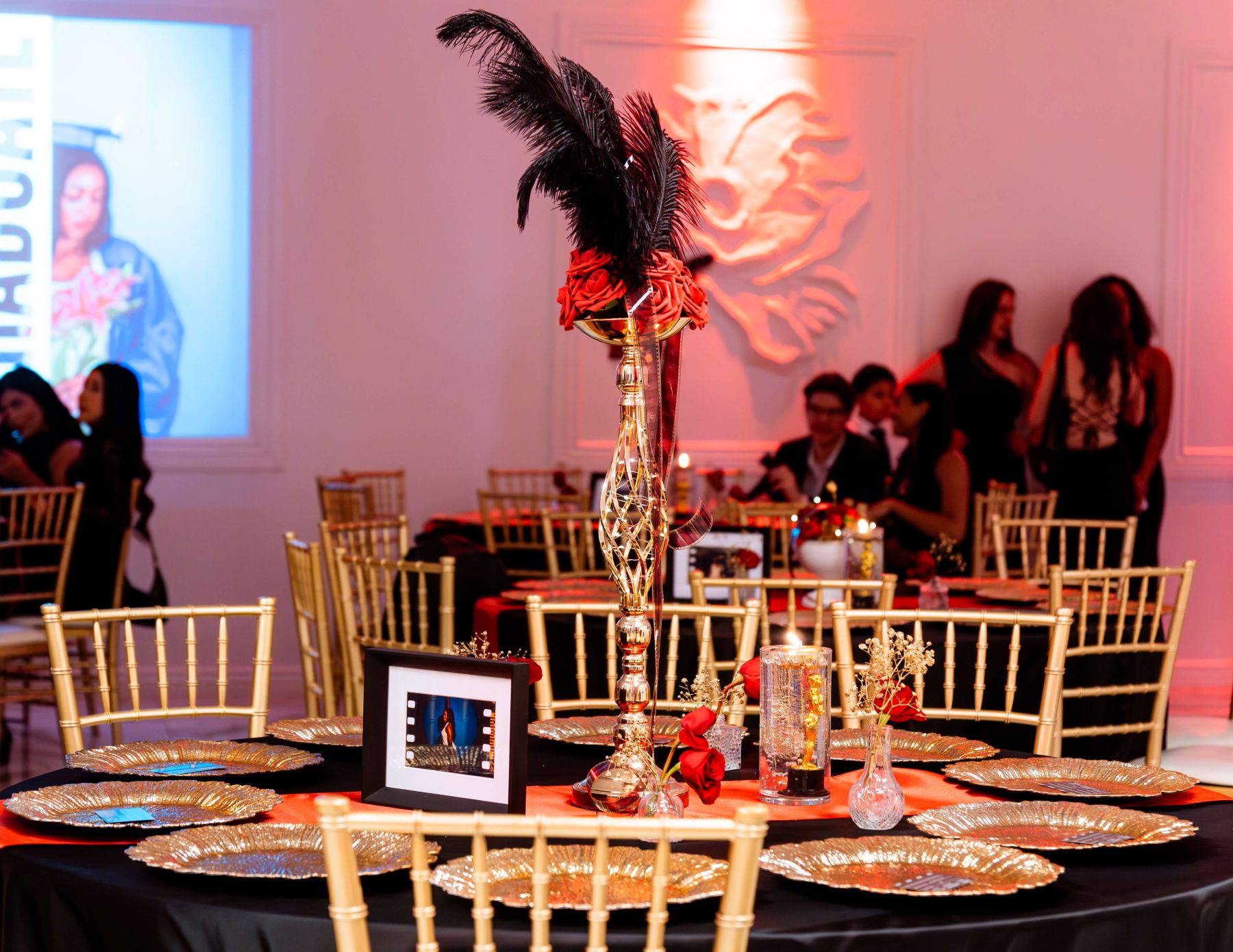 Wide view of the Hollywood gala space with marquee lighting and lush styling